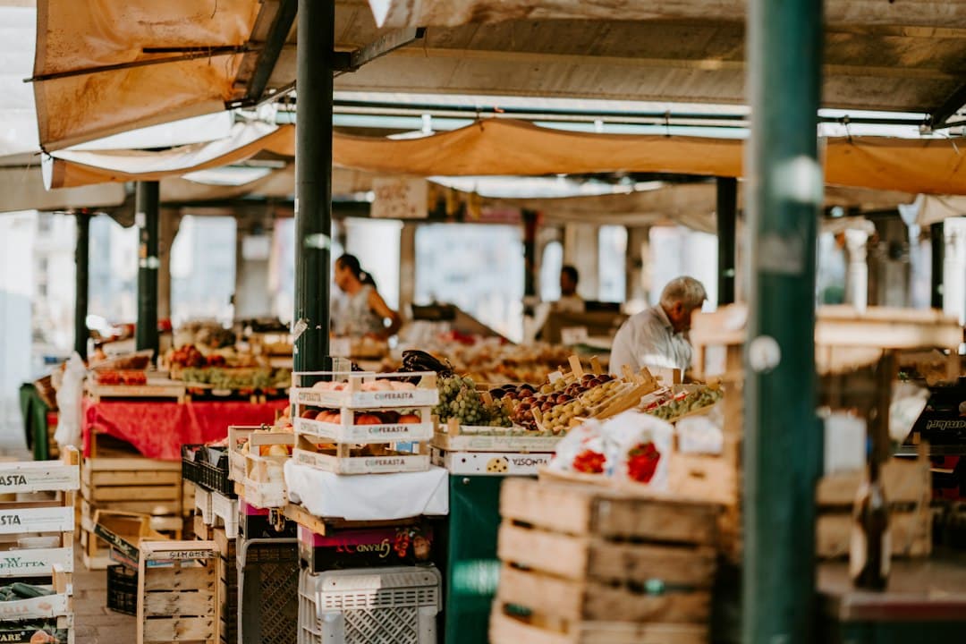 A fresh fruit and vegetable market stall in warm daylight
